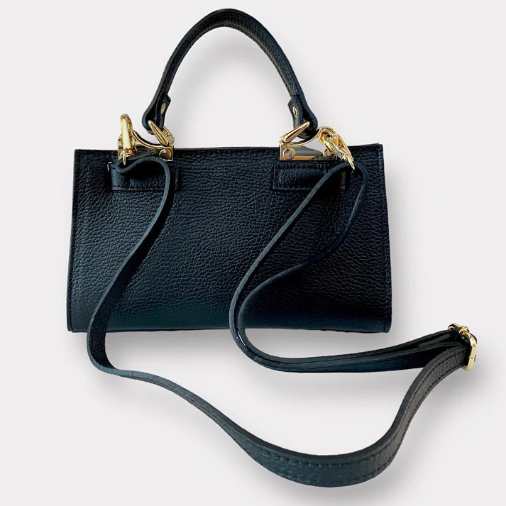 trasero bolso tote de piel negro, con correa extraible de cuero autentico. estilo new clasico. herrajes dorados